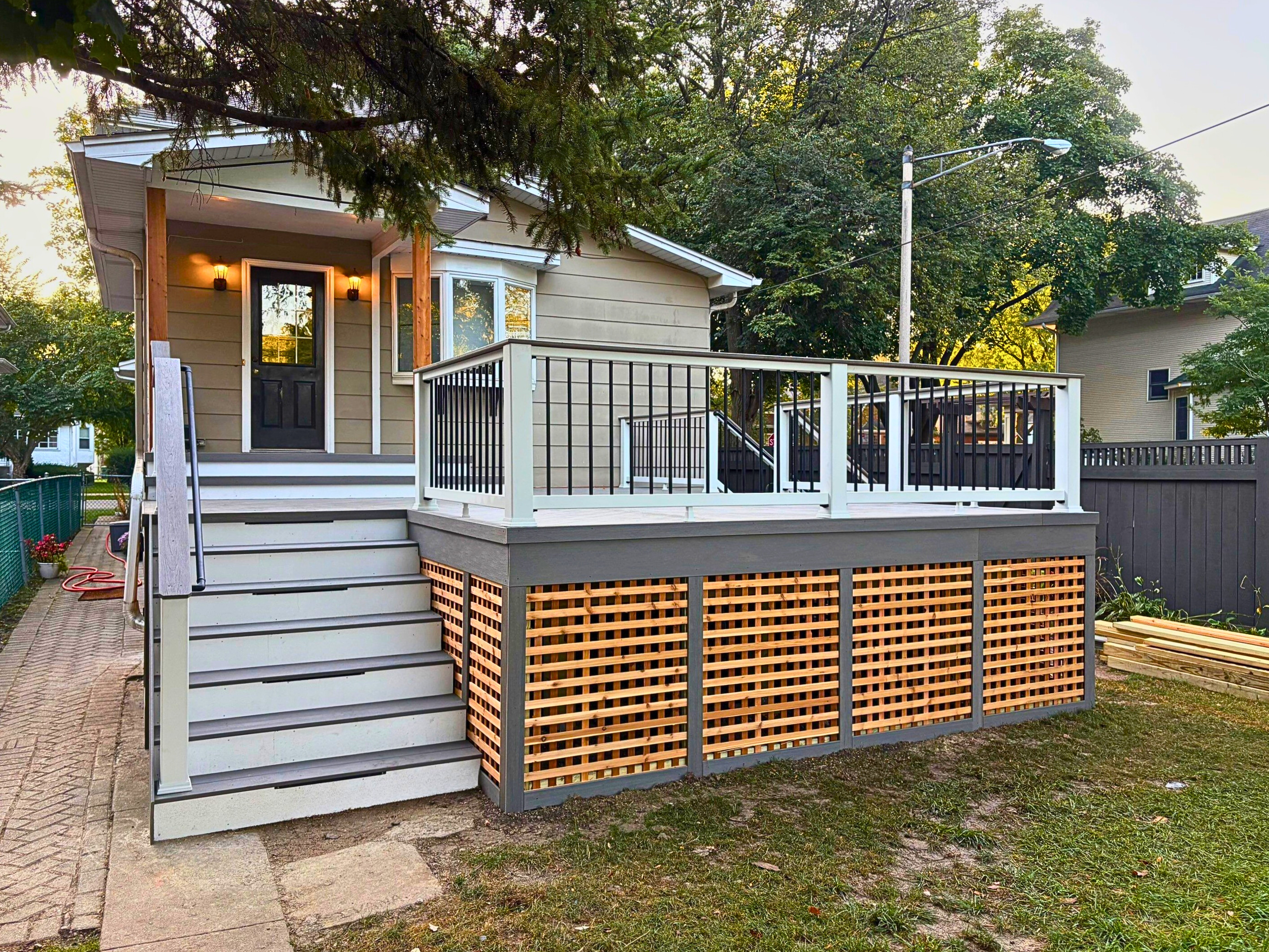 Timbertech deck replacement with lattice skirting and composite decking in oak park, il.